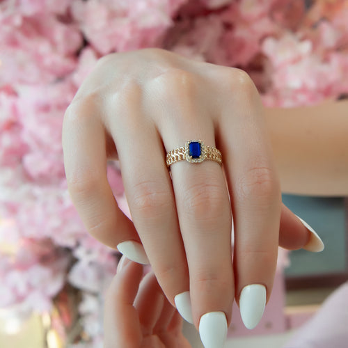 Stunning Gold Ring with Emerald Cut Blue Sapphire and Diamond Halo