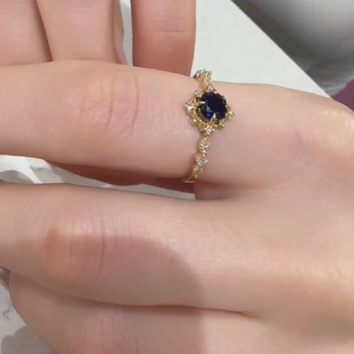 Exquisite Gold Ring with Round Blue Sapphire and Elegant Floral Design