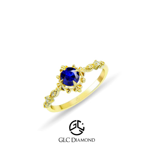 Exquisite Gold Ring with Round Blue Sapphire and Elegant Floral Design