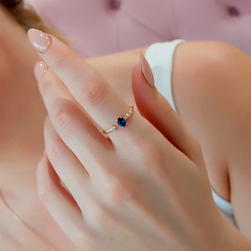 Minimalist 14K Gold Ring with Oval Blue Sapphire and Sparkling Diamond Accent