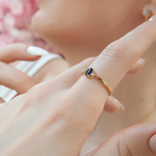 Minimalist 14K Gold Ring with Oval Blue Sapphire and Sparkling Diamond Accent